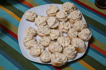 Garlic canapés with cheese on a roll.