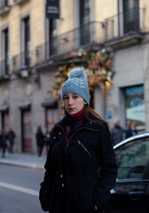 Young woman enjoying a cold and sunny winter day in Madrid Spain