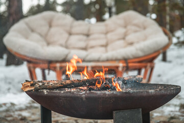 fire campfire bowl outdoors in winter. cozy atmosphere