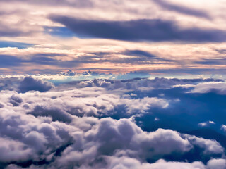 Cloudscape, fluffy Nimbus clouds from above at sunset, aerial view, Mont Blanc region, Chamonix, France