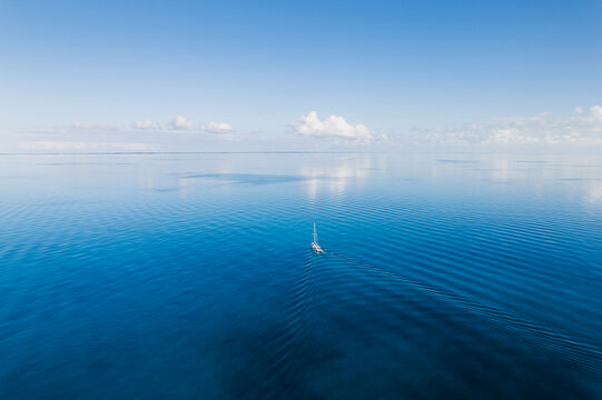Aerial of Sailboat in Flat Calm Seas in the Bahamas