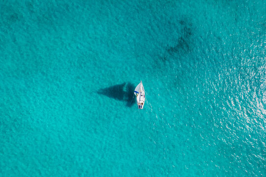 Aerial of Sailboat Sailing Through Turquoise Bahamas Waters