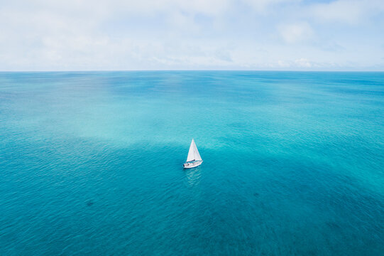 Aerial of Sailboat in Tropical Turquoise Waters in the Bahamas
