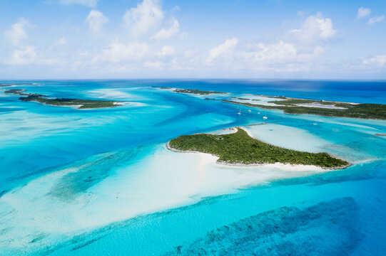 Aerial of Sailboats Anchored in Turquoise Waters Between Islands