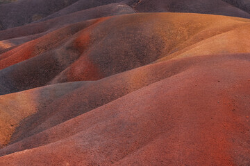 Unique seven gradual colors soil dunes - popular touristic destination on Mauritius island. Surrealistic geological formation found in the Chamarel on island's south. Beauty in Nature concept image.