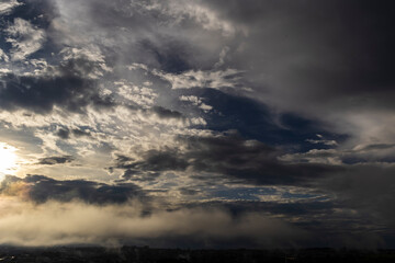 Dramatic sunset in the Sky through cumulus storm clouds, Timelapse. Awesome epic landscape. Amazing vibrant colors, in Brazil