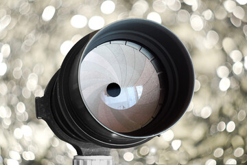vintage lens with 20 shutterblades, a real bokeh monster, swirly bokeh balls in the background,...
