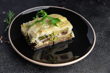 casserole vegetable eggplant, zucchini, green peas, cheese, bechamel sauce vegetables lasagne meal food snack on the table copy space food background rustic top view