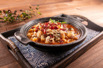 Spicy Chilli Boneless Boiled Fish served dish isolated on wooden table top view of Hong Kong food