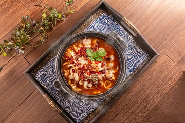 Spicy Chilli Boneless Boiled Fish served dish isolated on wooden table top view of Hong Kong food