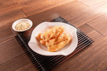 Crispy sugar dumplings served dish isolated on wooden table top view of Hong Kong food