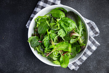 green salad leaves mix micro green, juicy healthy snack food on the table copy space food background rustic top view