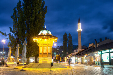 Fototapeta na wymiar Sarajevo at night - Historic fount and Bascarsija - Sarajevo, Bosnia, and Herzegovina