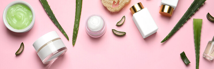 Flat lay composition with spa cosmetic products on pink background. Banner design