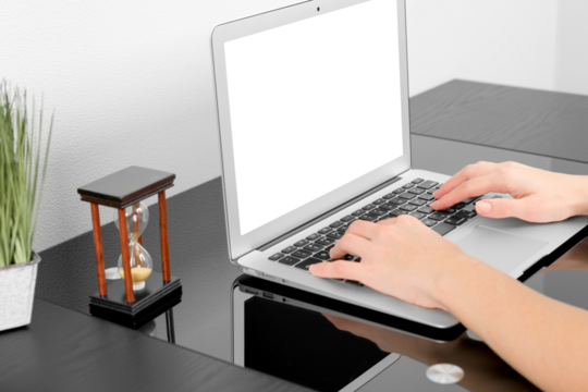 Mockup. Close up of hands typing on a laptop in a coffee shop