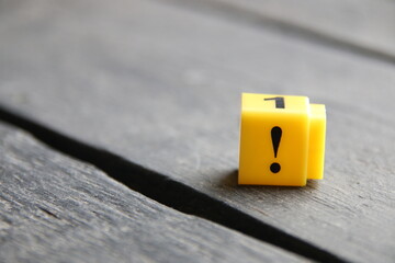Exclamation mark concept, inscription on yellow cubes.