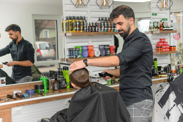 salon. close-up of a male haircut, the master does styling in a barbershop