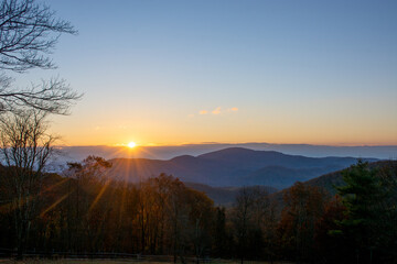 Blue Ridge Mountains sunrise coming up over the horizon, casting light on the valley