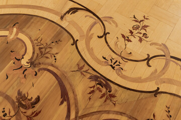 Vintage wooden parquet with floral inlay  pattern. Background photo