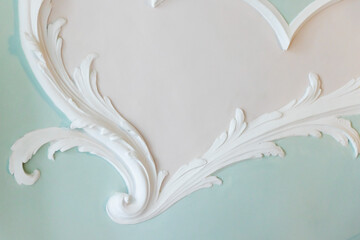 White gypsum bas-relief ceiling design details in rococo style