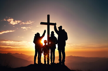 Silhouette of a family under a Christian cross placed on top of a mountain. The sun sets in the background. Illustration created with generative artificial intelligence.