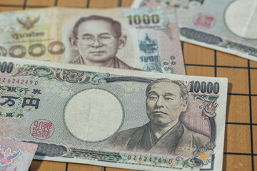Bank note of thailand and japan currency economic symbol