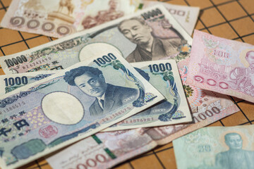 Obraz na płótnie Canvas Bank note of thailand and japan currency economic symbol