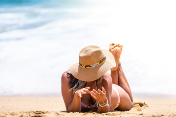 a young woman is relaxing at beach