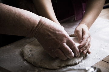 Naklejka premium hands baking bread together