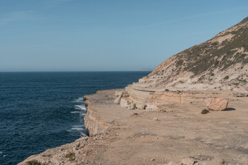 Panoramic view of eroding sandstone cliff at the coast of Malta