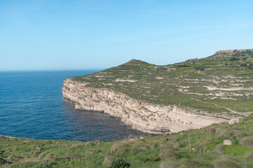 Fototapeta na wymiar Stunning green cliff view over the mediterranean sea in Malta