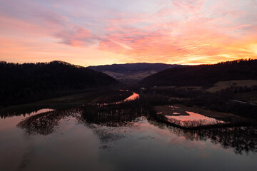 Sunset reflection in lake. Red sunset reflection. Fire sunset colors. Exceptional sunset in Bieszczady