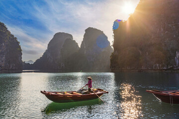 Female rower at Bai Tu Long Bay waiting for tourists, Vietnam © Reelistic