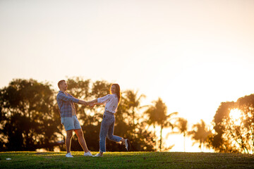 Fototapeta premium Family of two in the park on summer day outdoors