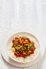 crispy ground beef with stir-fried veggies in bowl