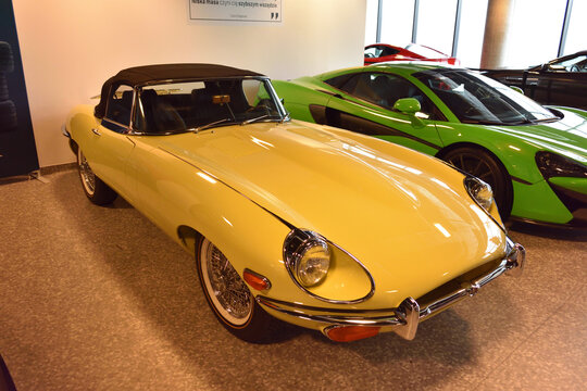 Jaguar E Type 1961, classic yellow retro sportscar (1961-1975) on exposition. WARSAW, POLAND - JANUARY 14 2023