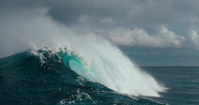 Large powerful ocean wave breaking in deep water, slow motion, power of nature, dramatic ocean storm