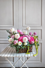 bouquet of flowers in a wicker basket