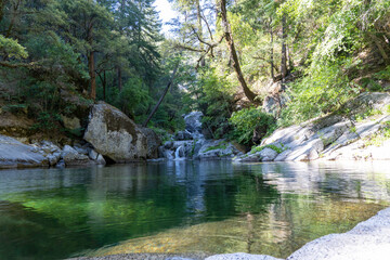 Naklejka na ściany i meble Middle Rock Creek watering hole and waterfall located in the Plumas National Forest, California 