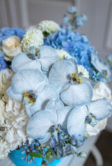 white and blue hydrangea, white roses, blue orchid