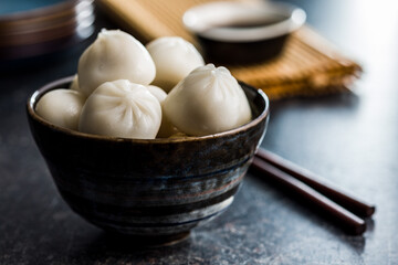 Fototapeta na wymiar Xiaolongbao, traditional steamed dumplings. Xiao Long Bao buns in bowl.