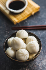 Xiaolongbao, traditional steamed dumplings. Xiao Long Bao buns in bowl.