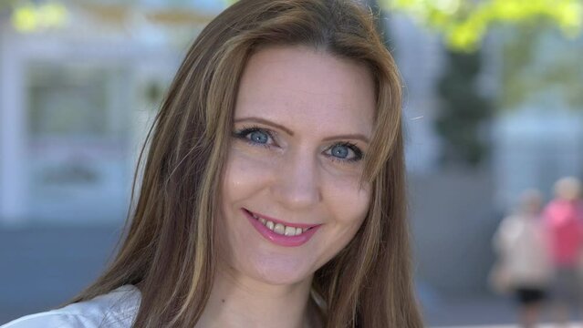 confidence, beauty - young attractive woman smiles seductively at the camera