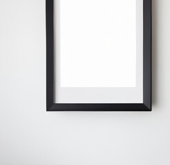 White wall with blank painting 