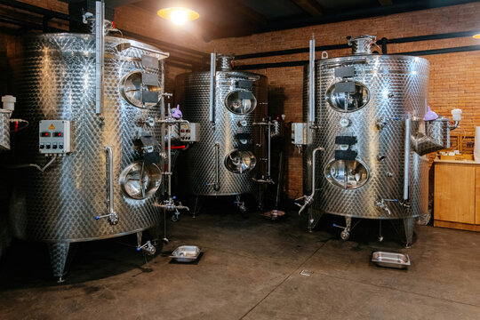 Modern stainless steel tanks for wine storage at the winery