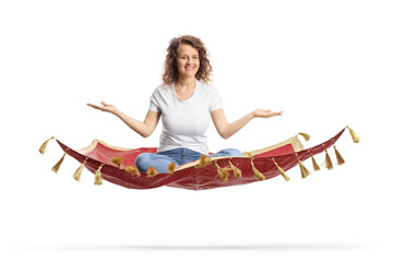 Young woman sitting on a flying carpet and gesturing with hands