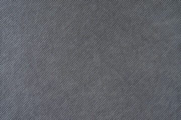 Texture background of velours gray fabric. Upholstery velveteen texture fabric, corduroy furniture...