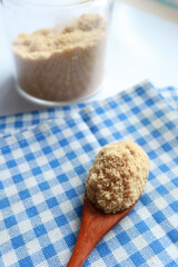 coconut sugar in a white bowl on table 