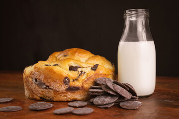 photography of homemade organic chocolate bread on the table with milk