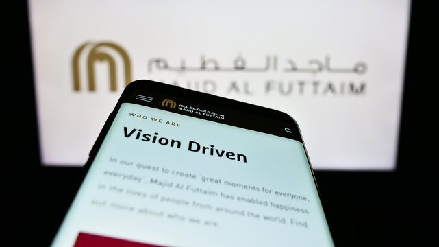 Stuttgart, Germany - 01-24-2023: Smartphone with website of Emirati company Majid Al Futtaim Group on screen in front of business logo. Focus on top-left of phone display.